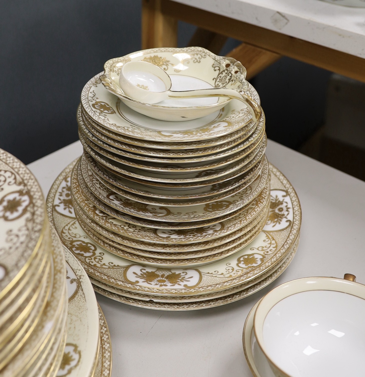 A Noritake gilt bordered dinner service